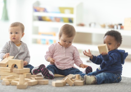 Babies playing with blocks at Infant Day Care in Peoria IL