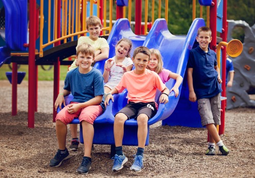 Children on a slide at the best daycare in Peoria IL