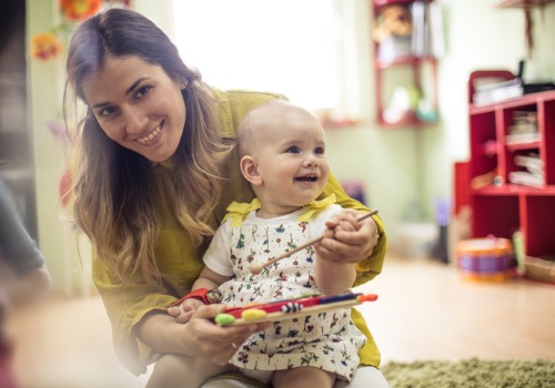 Instructor having one-on-one time with child during Peoria Infant Care