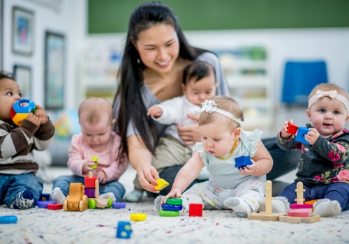 A teaching playing with children during Peoria Infant Care