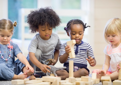 Kids play with building blocks at PALS, the Best Daycare in Peoria County IL