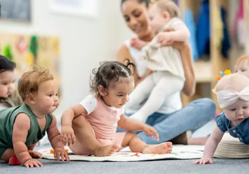 A group of babies play at PALS, which provides Childcare Facilities in Peoria IL